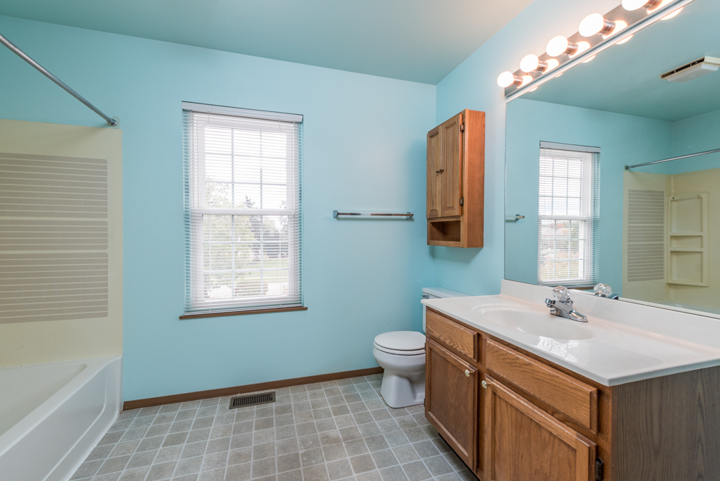 34321 Homestead Road Gurnee, IL 60031 - Photo 28 of 30 a bathroom with a sink toilet and mirror