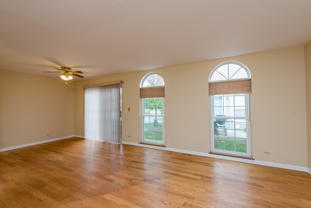 34321 Homestead Road Gurnee, IL 60031 - Photo 10 of 30 wooden floor in an empty room with a window