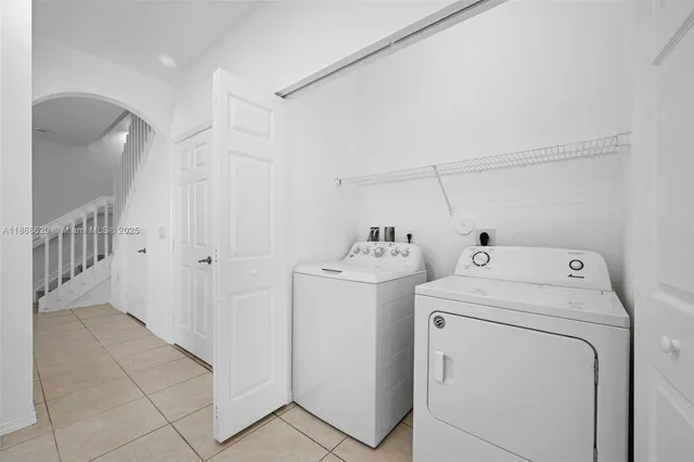 a view of storage and utility room with washer and dryer