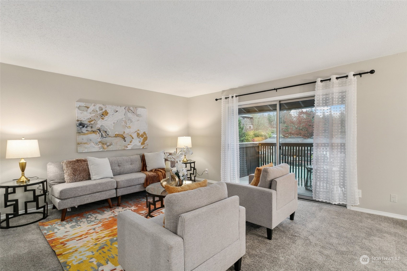 1425 South Puget Drive, Unit H5 Renton, WA 98055 - Photo 1 of 29 a living room with furniture and a large window