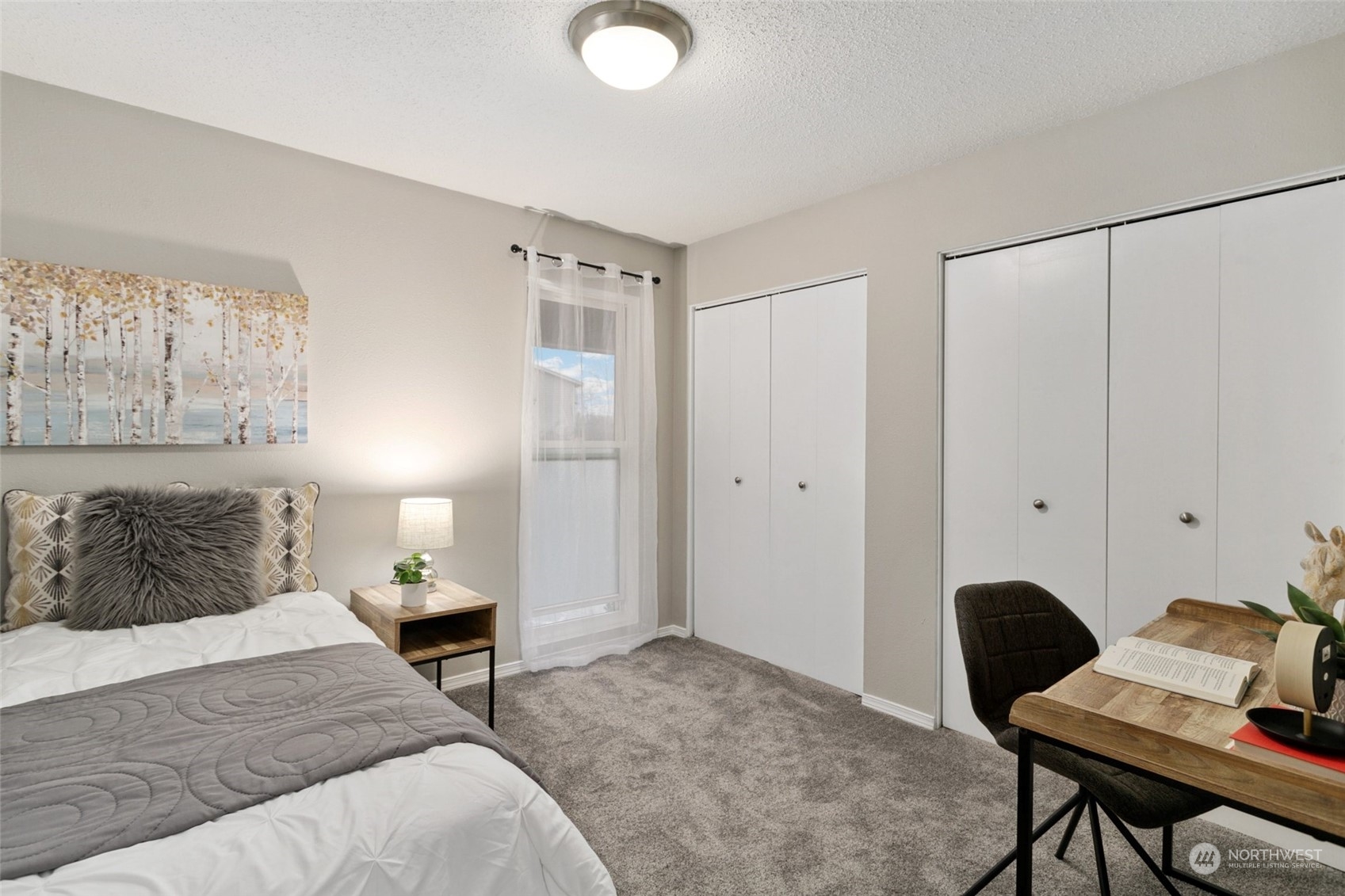 1425 South Puget Drive, Unit H5 Renton, WA 98055 - Photo 16 of 29 a bedroom with a bed and a table