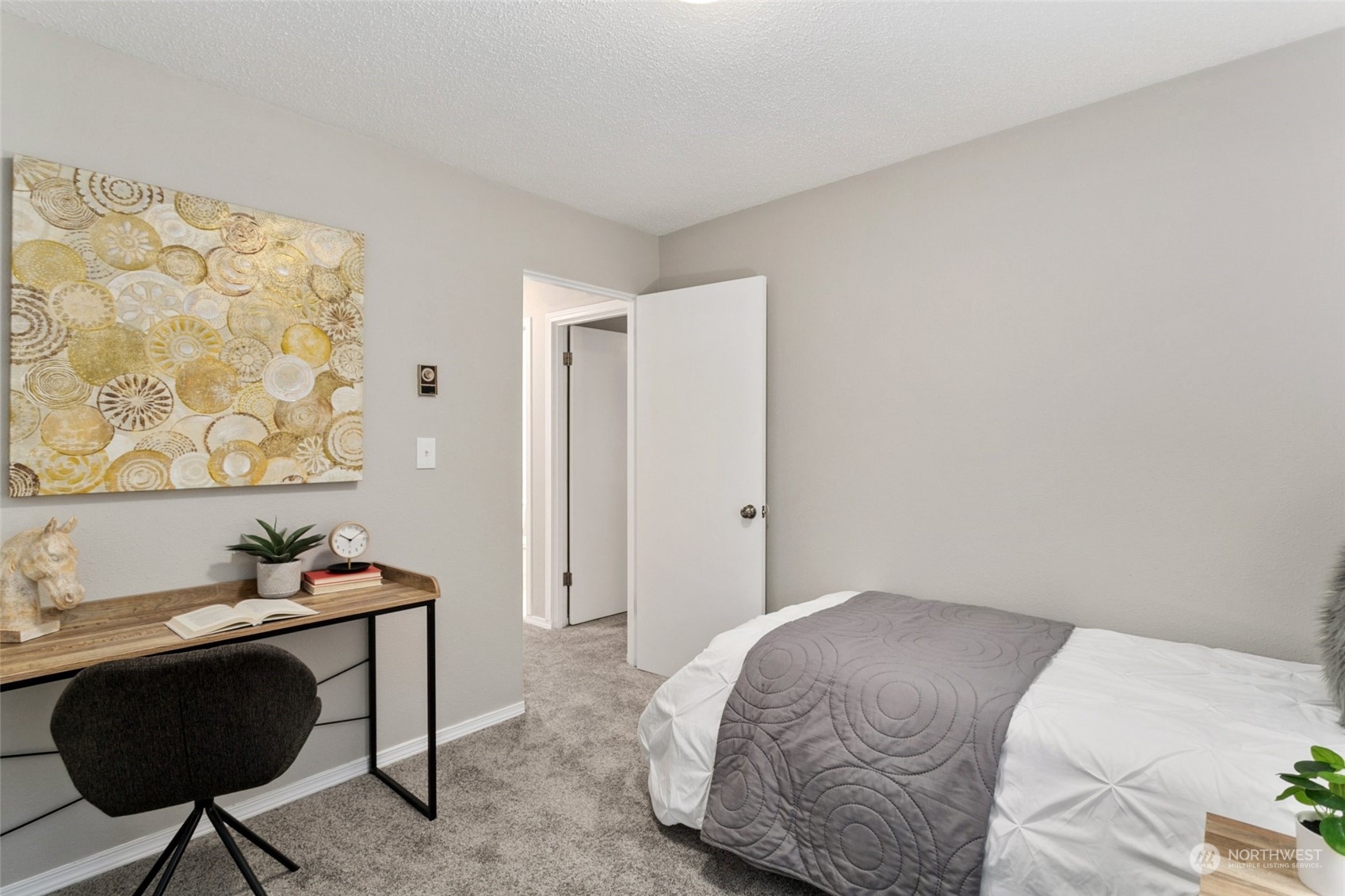 1425 South Puget Drive, Unit H5 Renton, WA 98055 - Photo 17 of 29 a bedroom with a bed and a chair