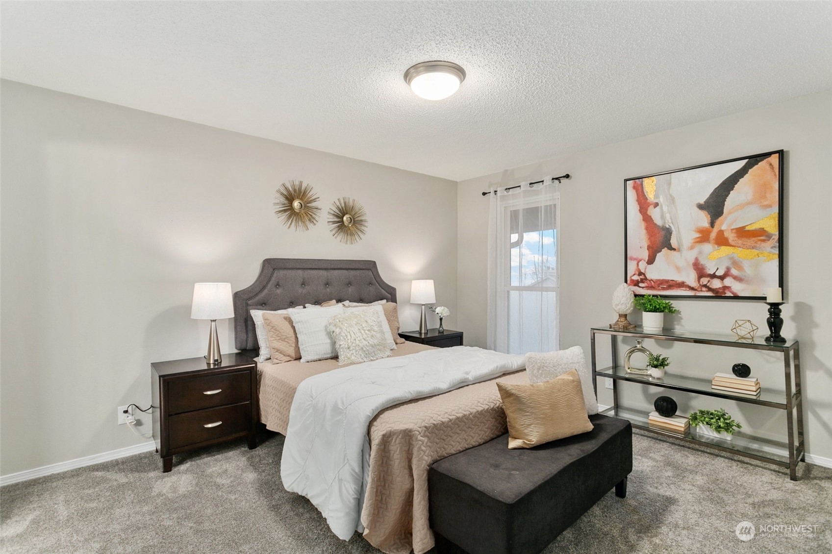 1425 South Puget Drive, Unit H5 Renton, WA 98055 - Photo 18 of 29 a bedroom with a bed and a painting on the wall