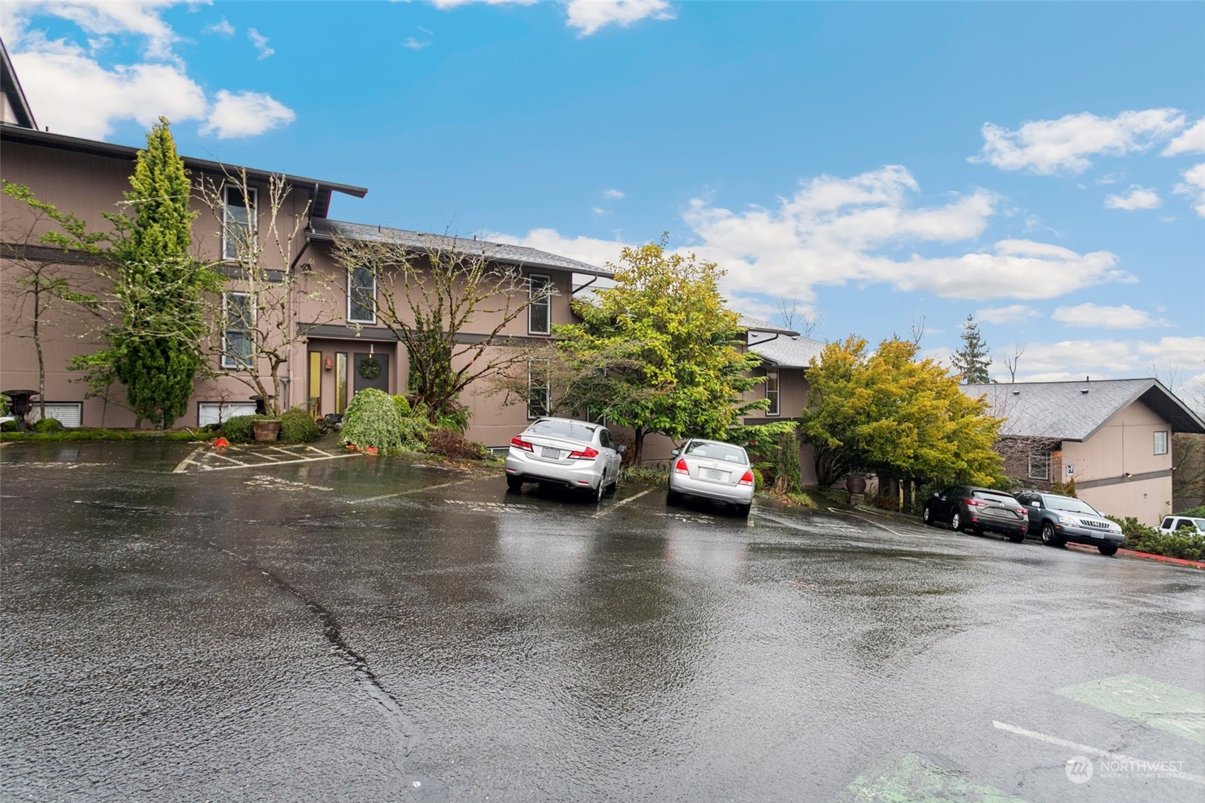 1425 South Puget Drive, Unit H5 Renton, WA 98055 - Photo 29 of 29 a view of a street with cars