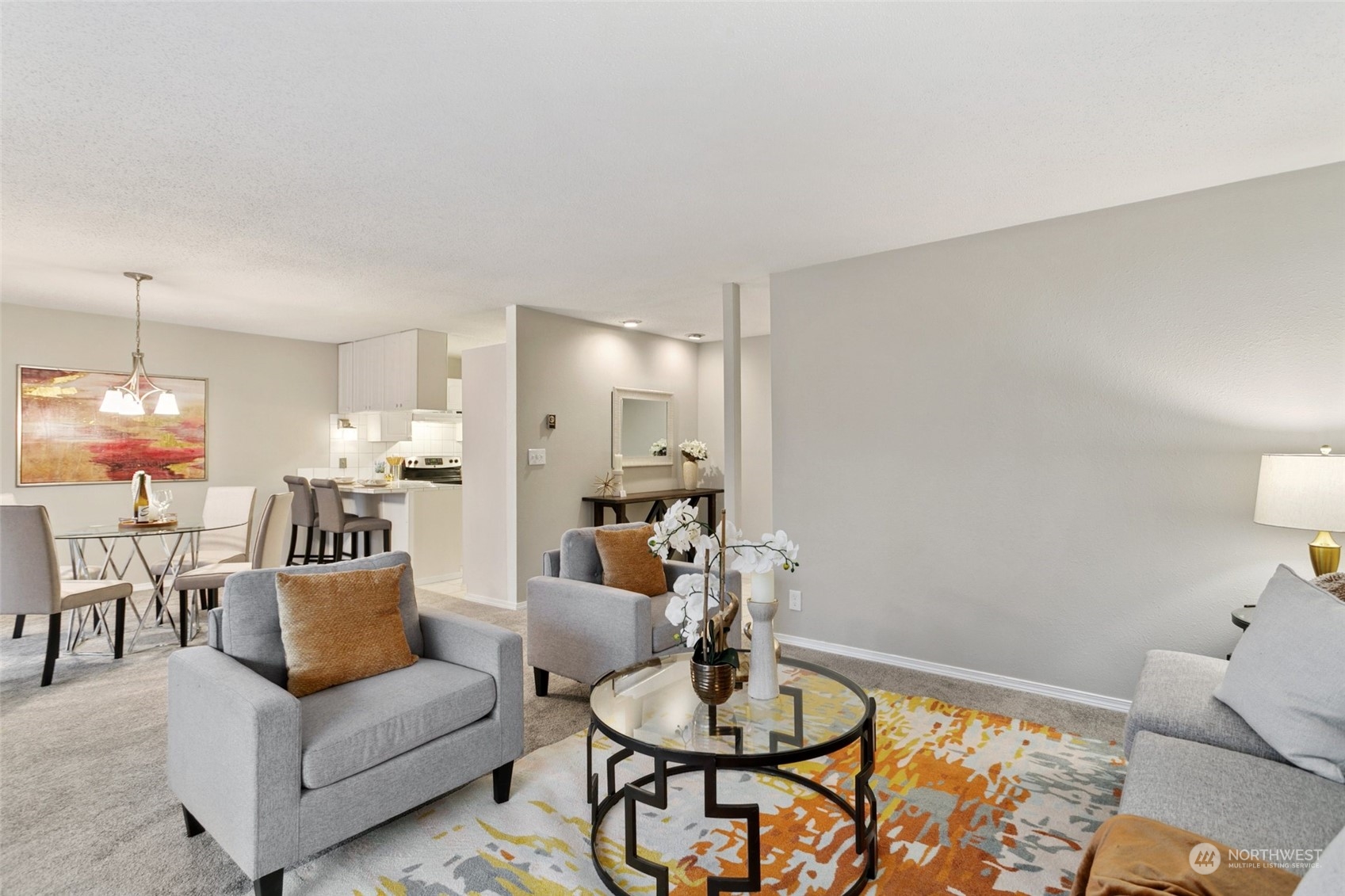 1425 South Puget Drive, Unit H5 Renton, WA 98055 - Photo 5 of 29 a living room with furniture and a wooden floor