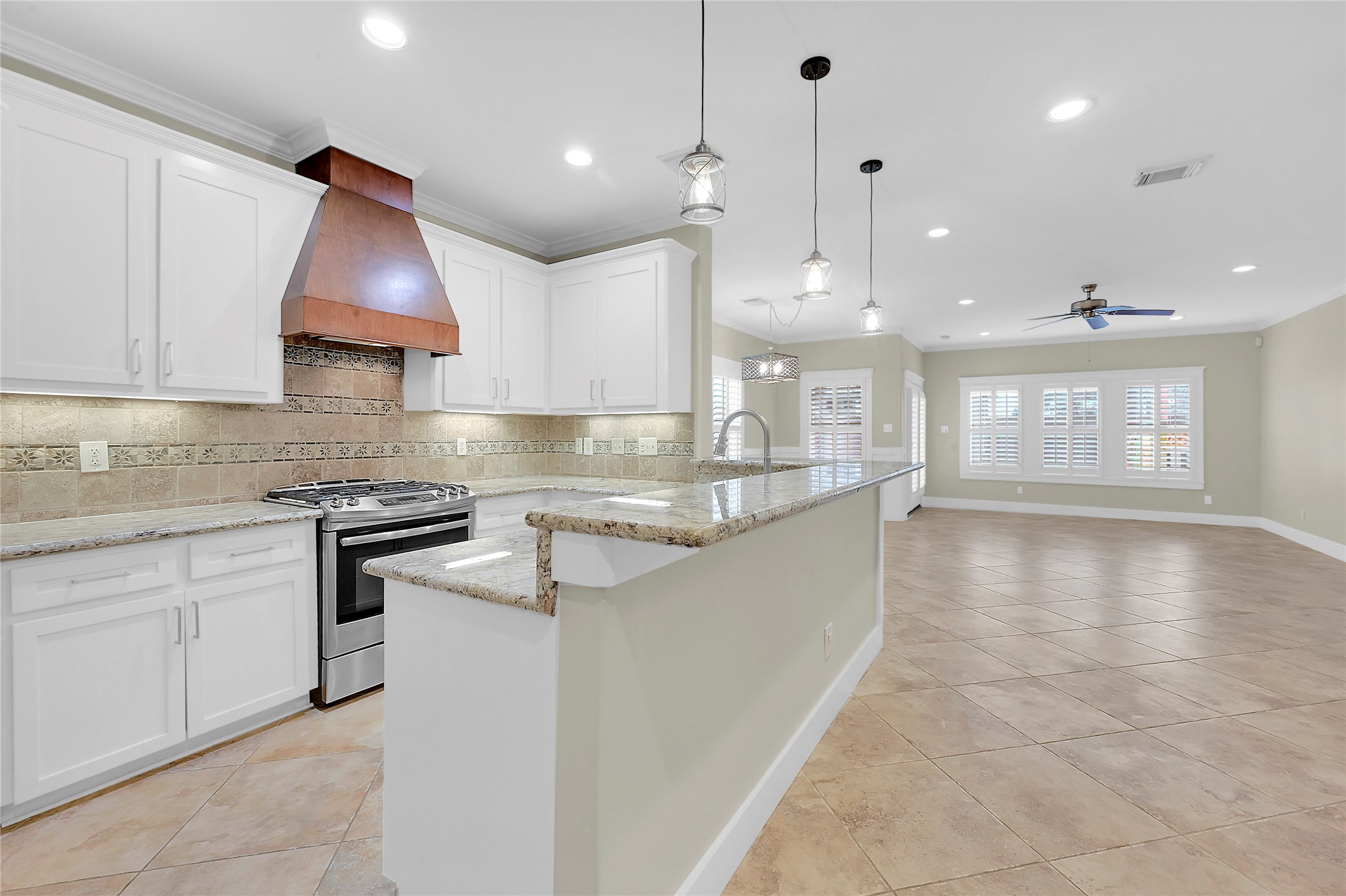 4418 Edsee Street Houston, TX 77009 - Photo 8 of 28 Extra seating in the kitchen's massive peninsula for added convenience.