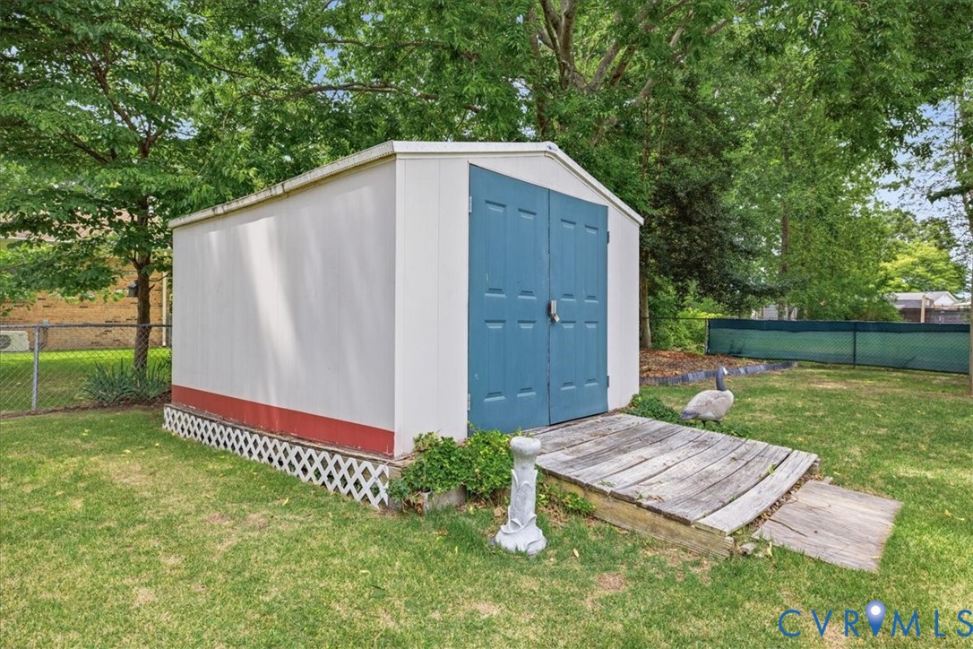 13308 South Chester Road Chester, VA 23831 - Photo 36 of 41 Charming storage shed featuring a blue double-door