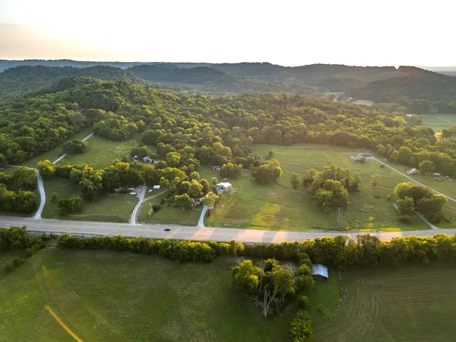 a view of a wooden chairs on the deck