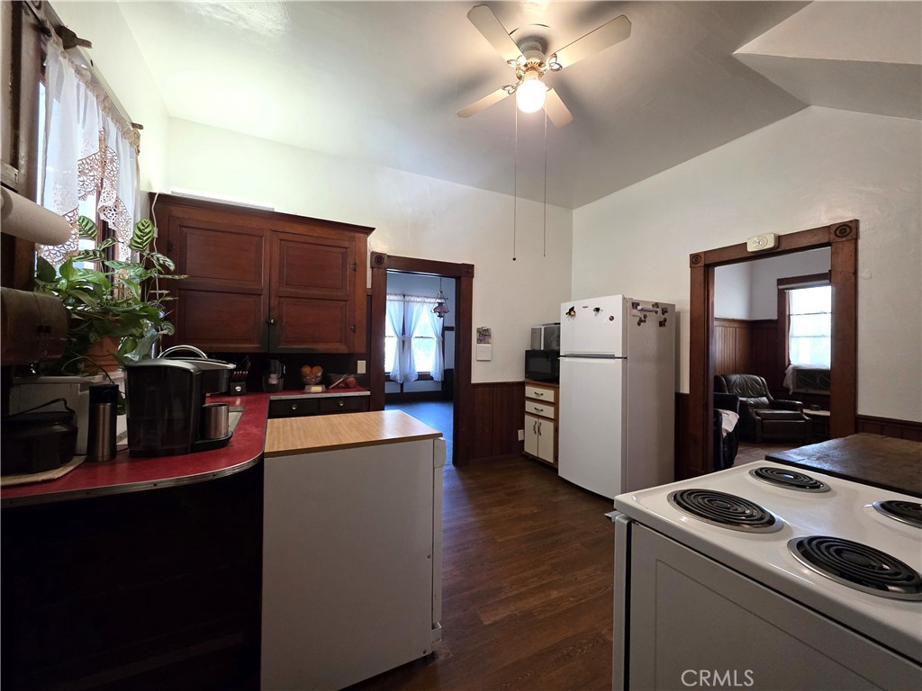 1414 Marin Street Corning, CA 96021 - Photo 8 of 43 a kitchen that has a refrigerator and a stove in it