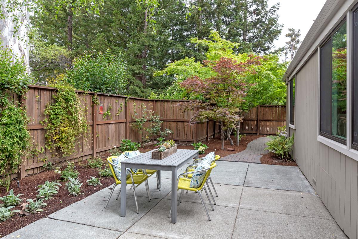 8 Farm Road Los Altos, CA 94024 - Photo 14 of 19 a view of a chairs and table in a backyard