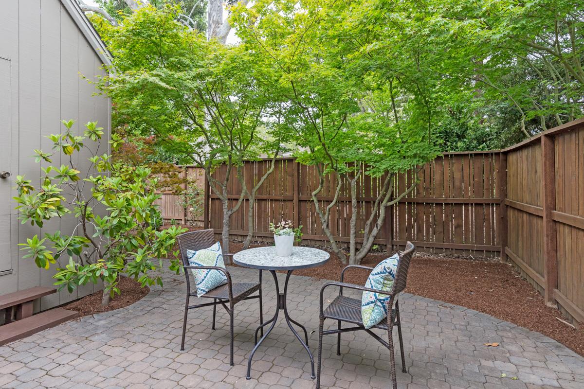 8 Farm Road Los Altos, CA 94024 - Photo 17 of 19 a view of a chairs and table in the back yard