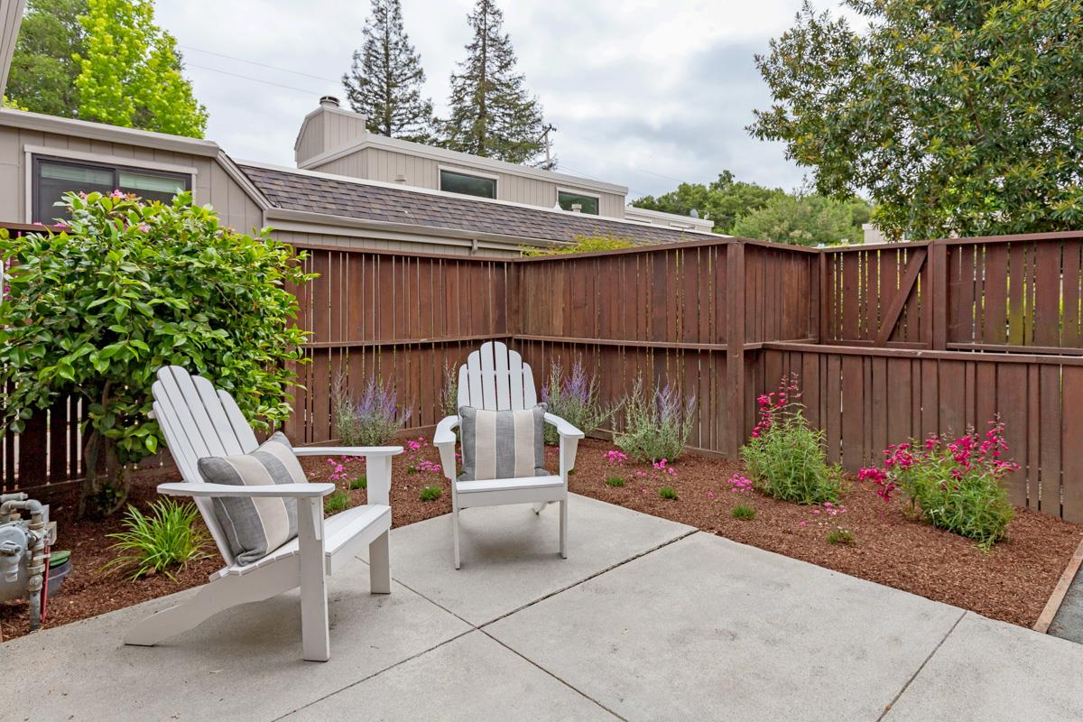 8 Farm Road Los Altos, CA 94024 - Photo 18 of 19 a view of a chair and table in the back yard of the house
