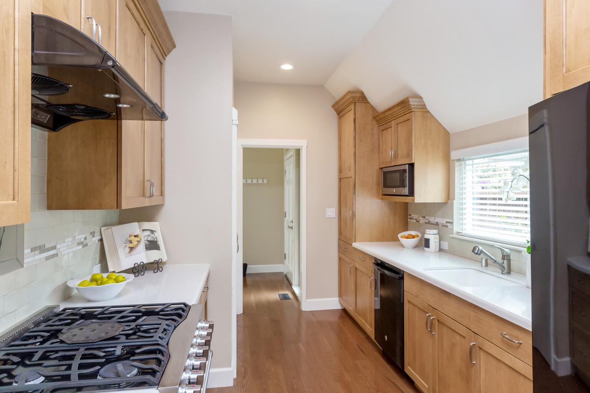 8 Farm Road Los Altos, CA 94024 - Photo 5 of 19 a kitchen with a sink stove and cabinets