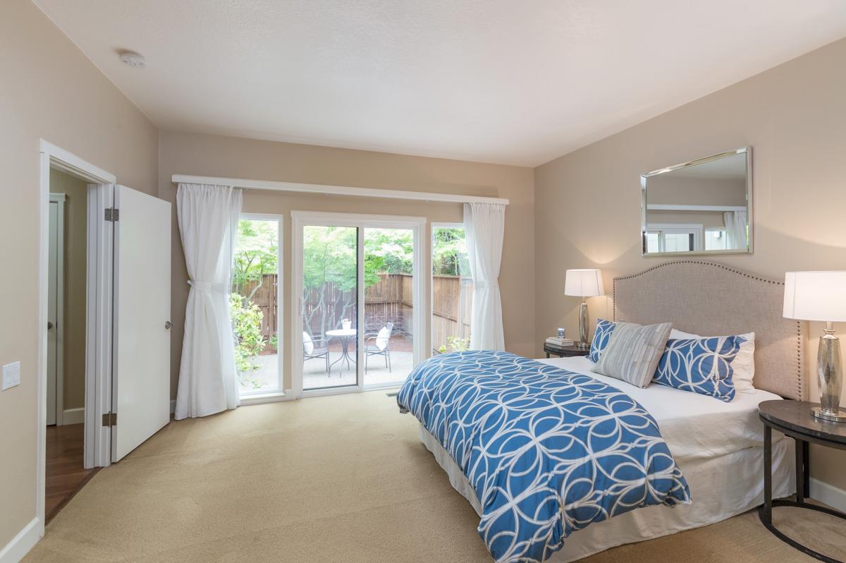 8 Farm Road Los Altos, CA 94024 - Photo 8 of 19 a bedroom with a large bed and a large window