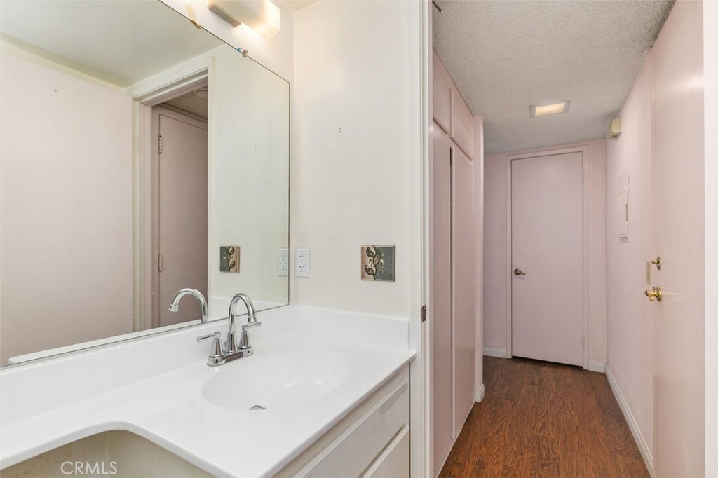 7718 Rambling Brook Way Stanton, CA 90680 - Photo 17 of 23 a bathroom with a sink and a mirror