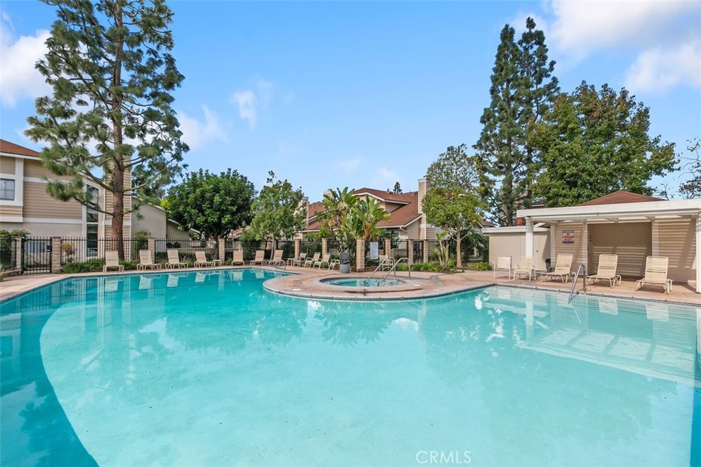 7718 Rambling Brook Way Stanton, CA 90680 - Photo 20 of 23 a view of a house with swimming pool and sitting area