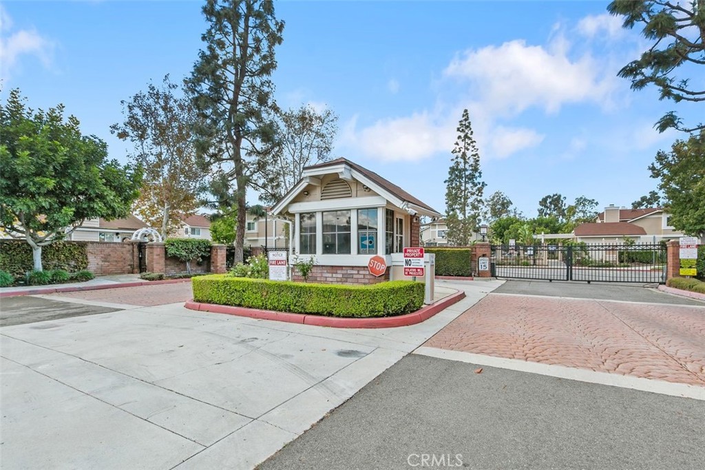 7718 Rambling Brook Way Stanton, CA 90680 - Photo 23 of 23 a front view of a house with a garden