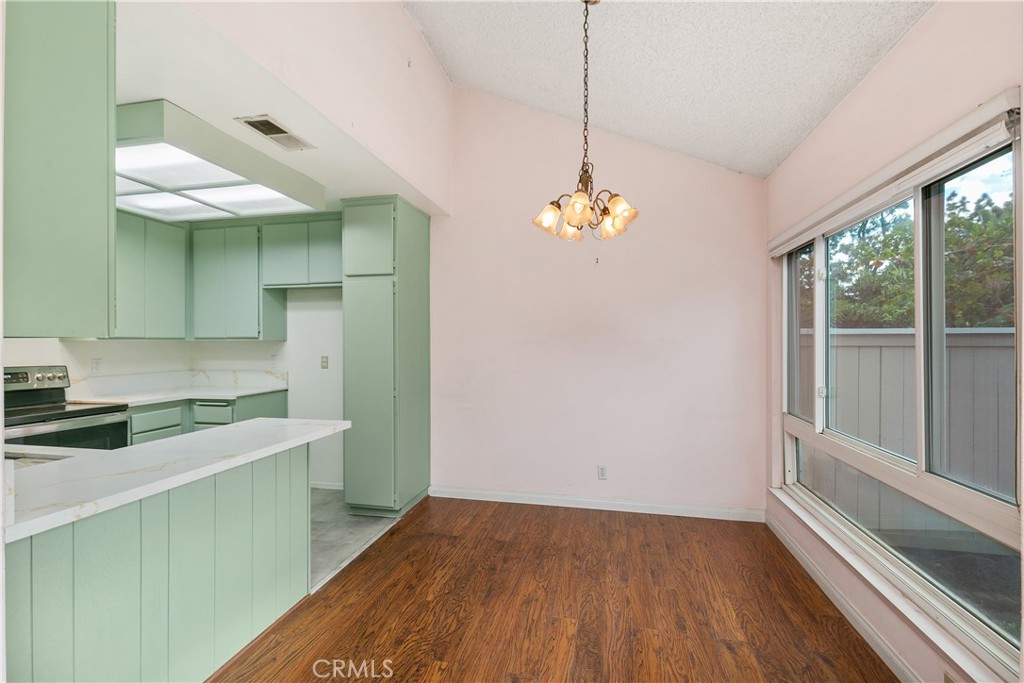 7718 Rambling Brook Way Stanton, CA 90680 - Photo 6 of 23 a view of a kitchen with a sink cabinets and a window