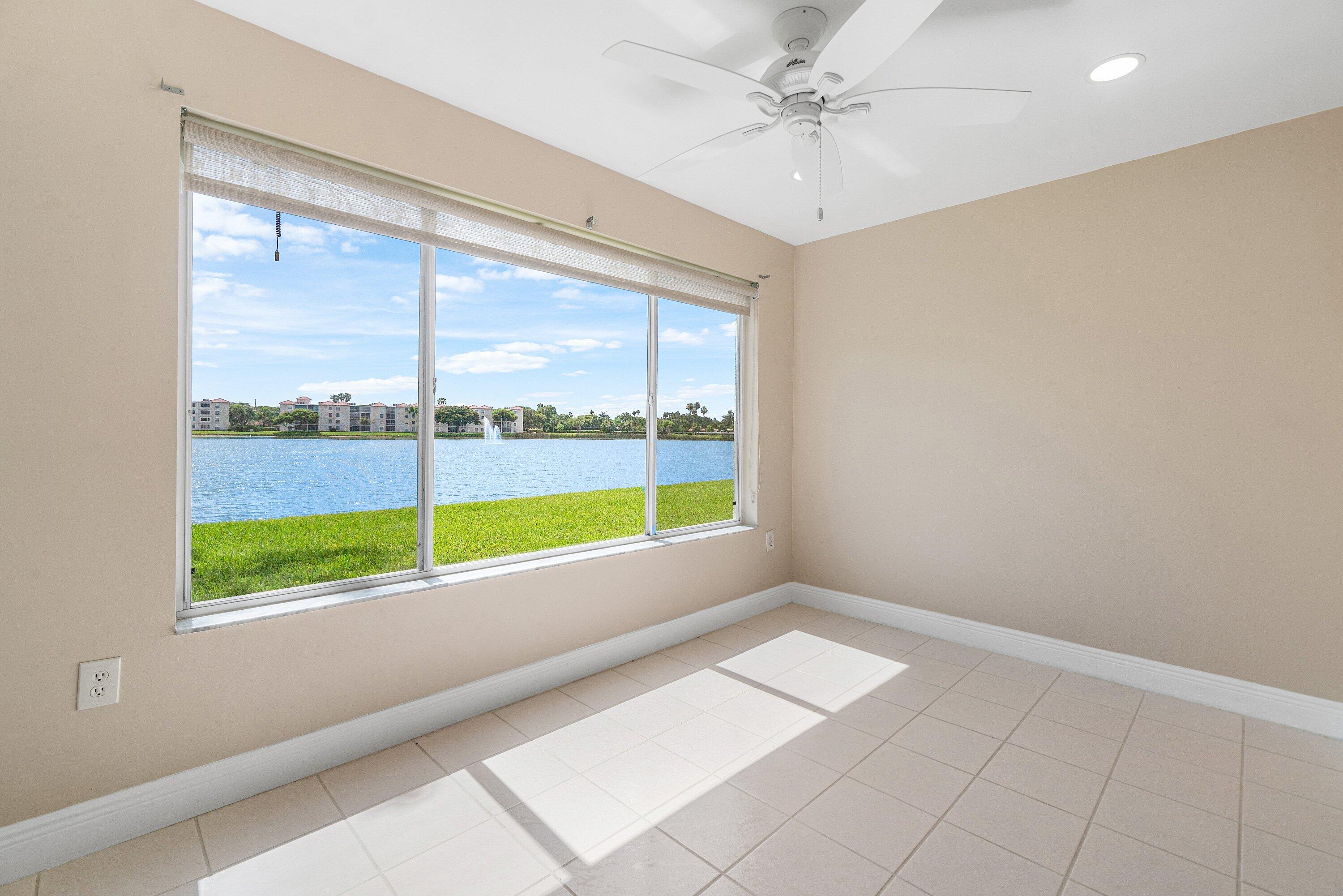 14096 Huntington Pointe Drive, Unit 106 Delray Beach, FL 33484 - Photo 30 of 47 a view of an empty room with a window