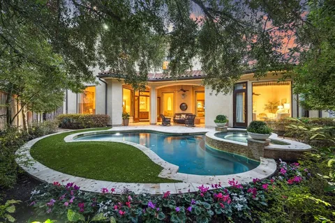 a view of a swimming pool with an outdoor seating