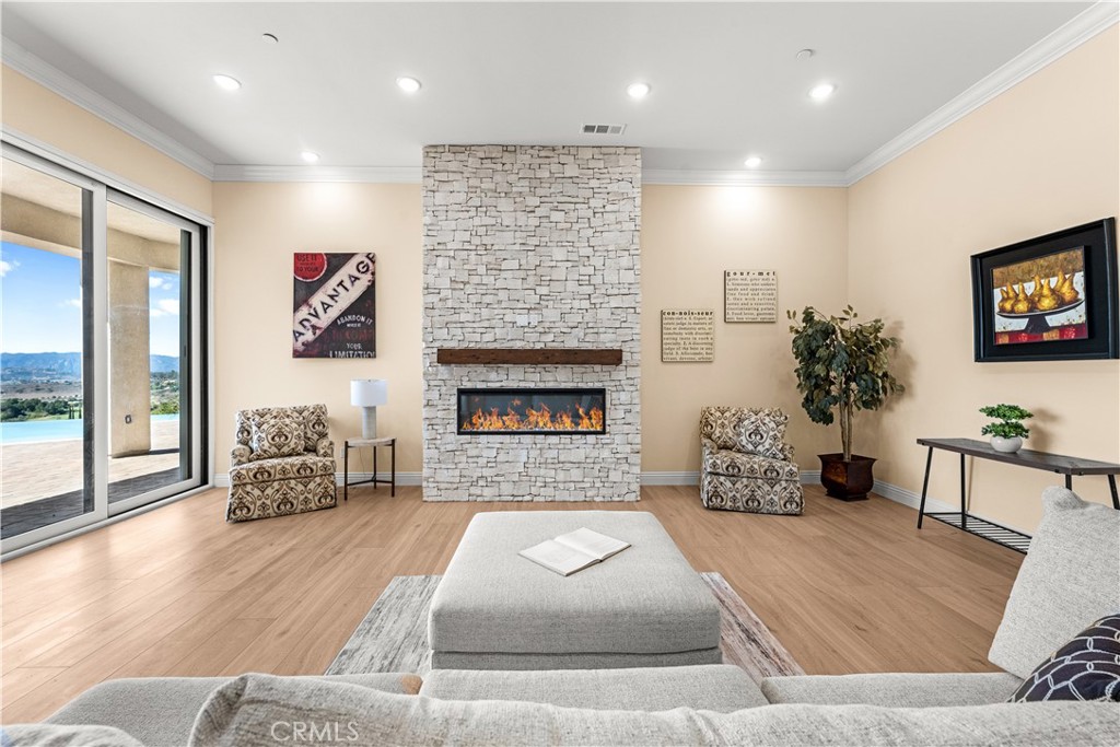 25700 El Chaval Place Temecula, CA 92590 - Photo 25 of 66 a living room with furniture and a fireplace