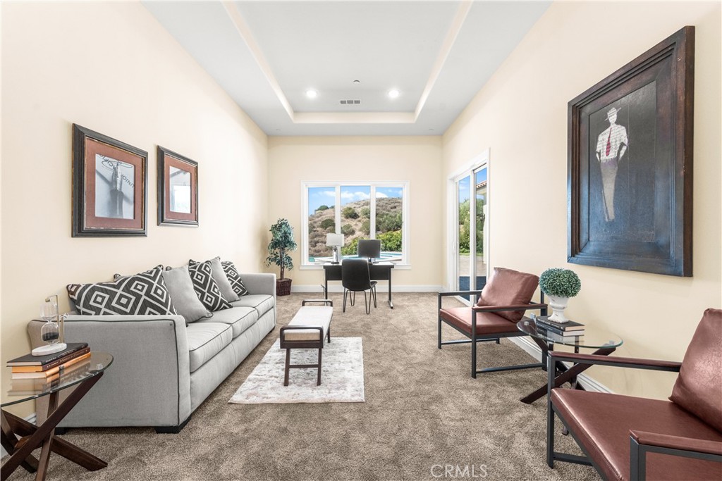 25700 El Chaval Place Temecula, CA 92590 - Photo 38 of 66 a living room with furniture and a window