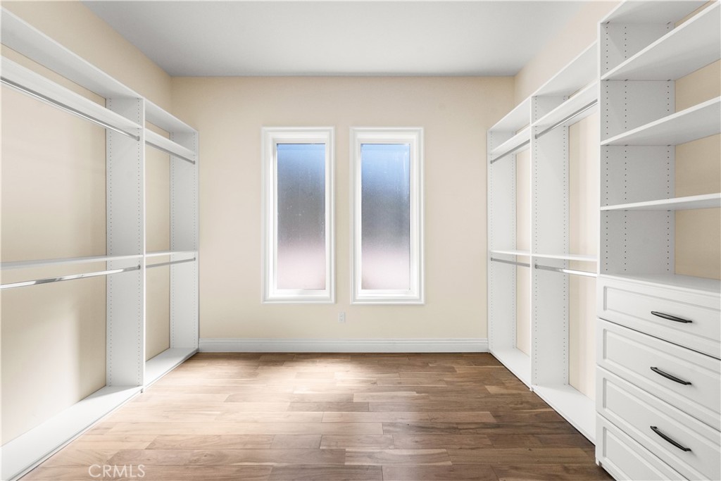 25700 El Chaval Place Temecula, CA 92590 - Photo 44 of 66 a view of an empty room with wooden floor and a window