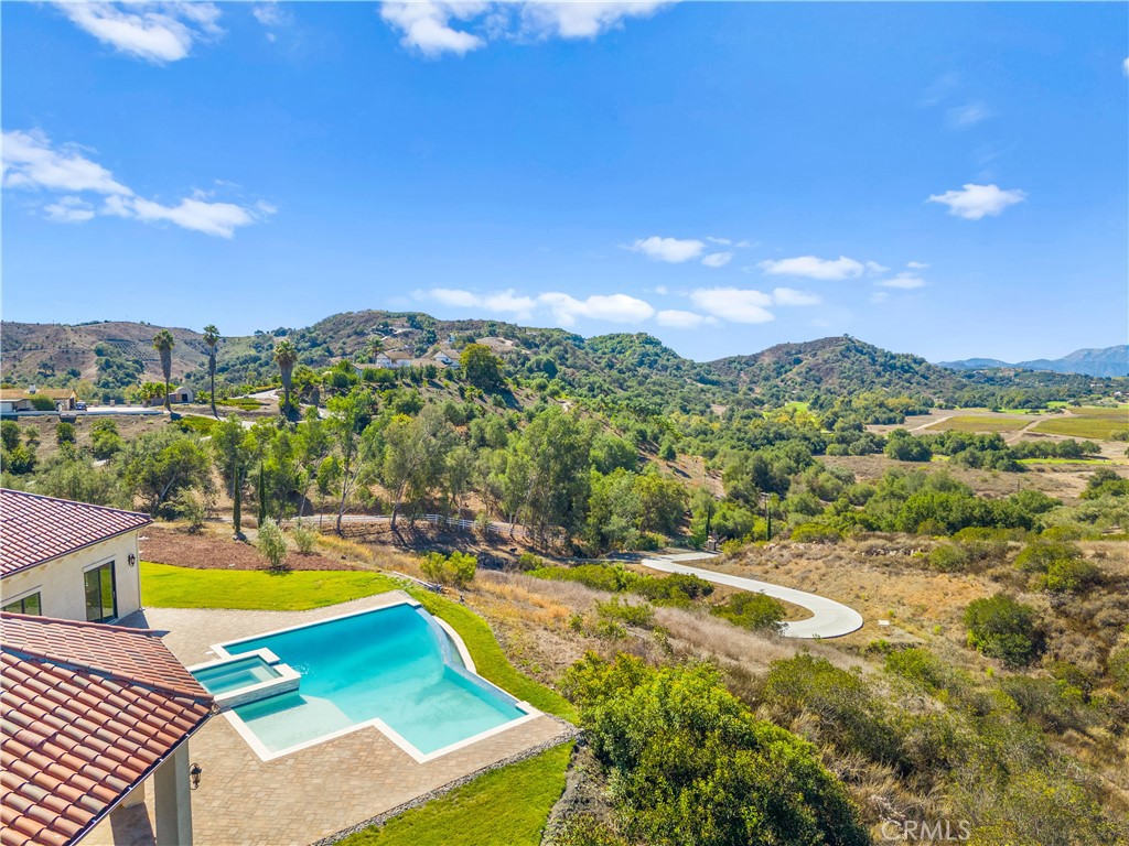 25700 El Chaval Place Temecula, CA 92590 - Photo 63 of 66 a view of a city with swimming pool and mountains