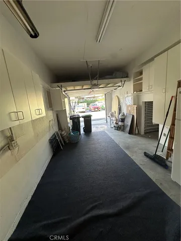 a view of a hallway with washer and dryer