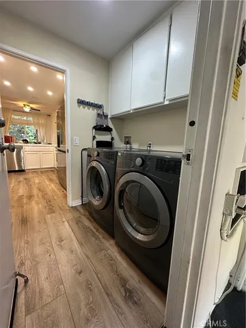 a kitchen with granite countertop a refrigerator and a sink