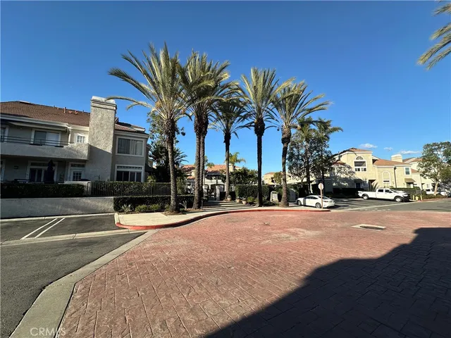a view of a patio with table and chairs and potted plants