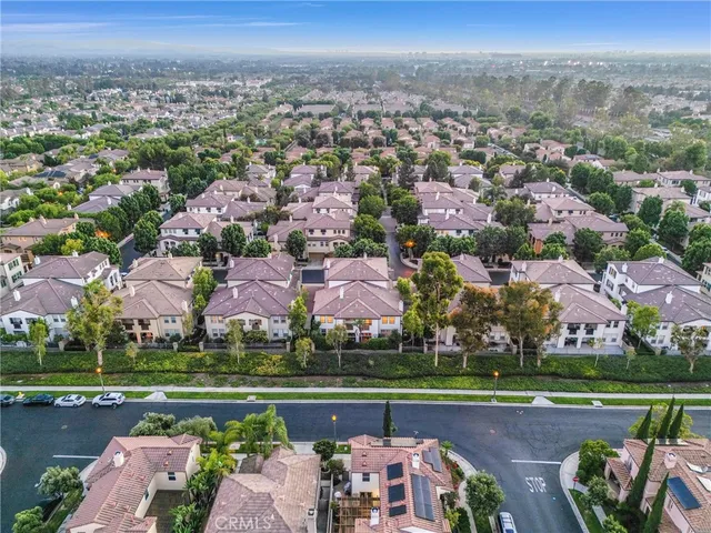 an aerial view of a house with a lake view