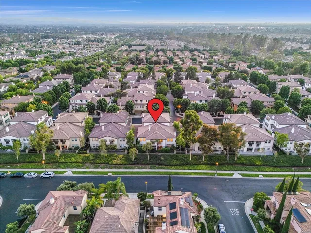 an aerial view of a house with a lake view