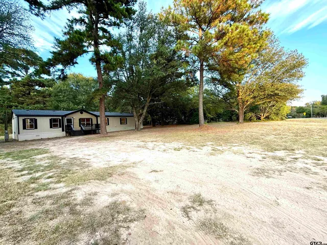 a house with trees in front of it