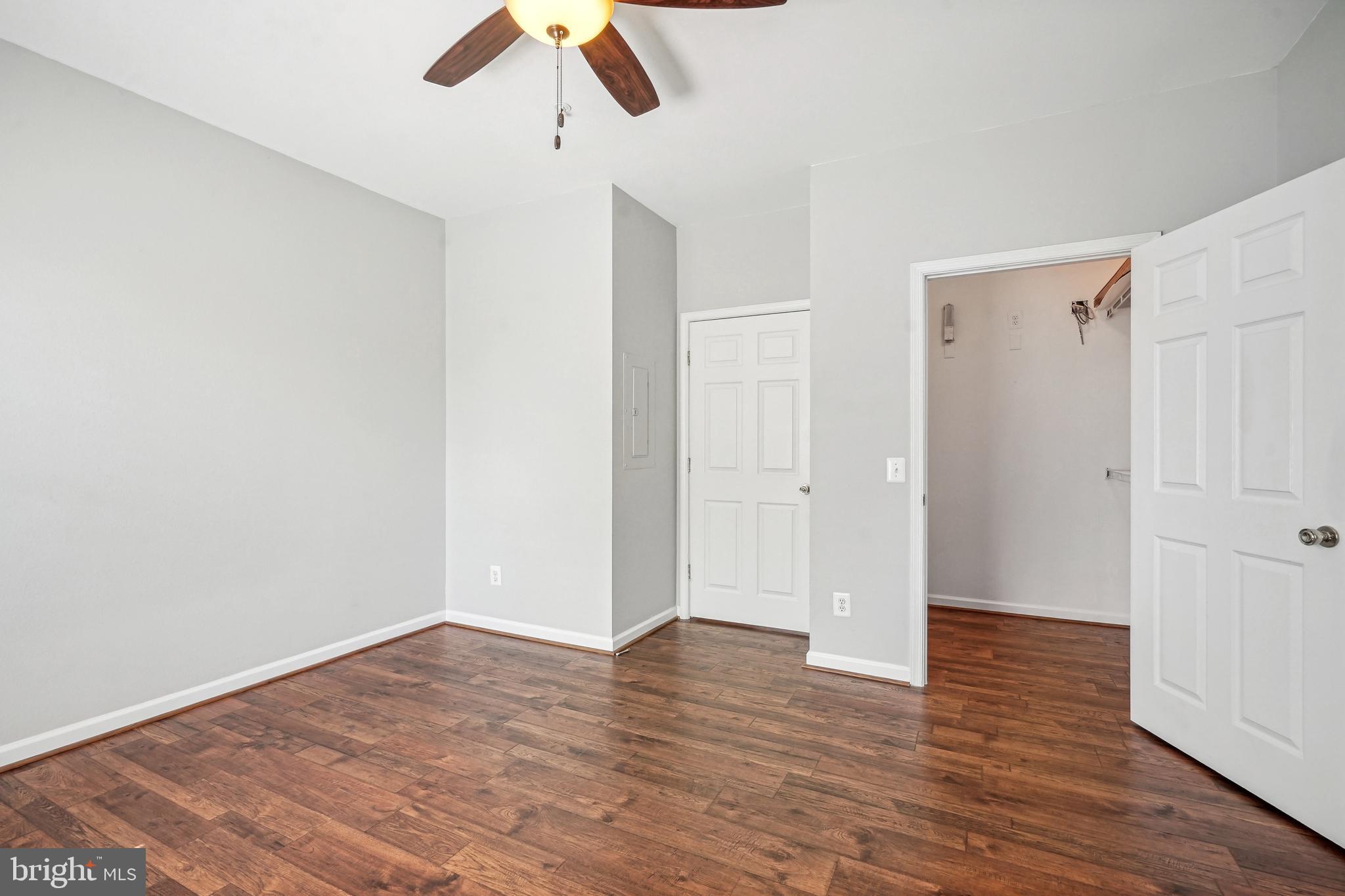 1601 Spring Gate Dr., Unit 1210 McLean, VA 22102 - Photo 12 of 18 a view of an empty room with wooden floor