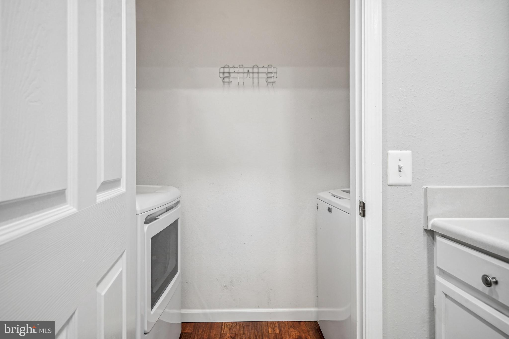 1601 Spring Gate Dr., Unit 1210 McLean, VA 22102 - Photo 7 of 18 a bathroom with a sink and a mirror