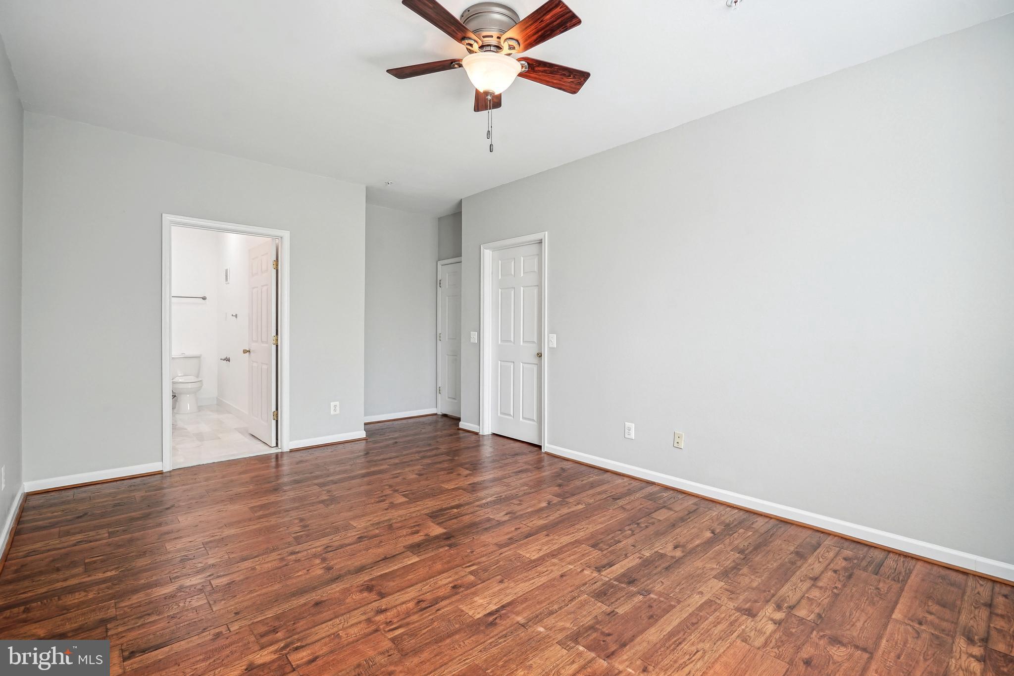 1601 Spring Gate Dr., Unit 1210 McLean, VA 22102 - Photo 8 of 18 wooden floor in an empty room