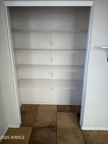 a bathroom with a sink toilet and a mirror