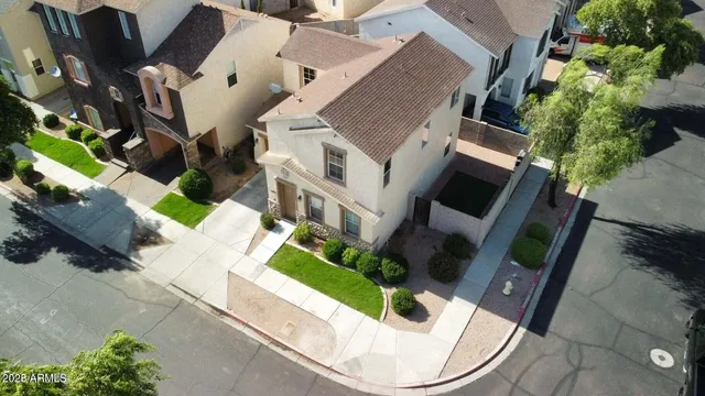 an aerial view of a house with outdoor space