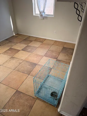 a kitchen with granite countertop a stove top oven microwave and cabinets