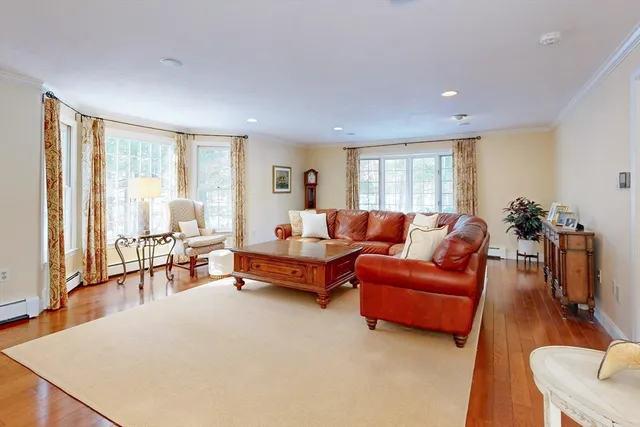 a bathroom with a granite countertop toilet sink and mirror