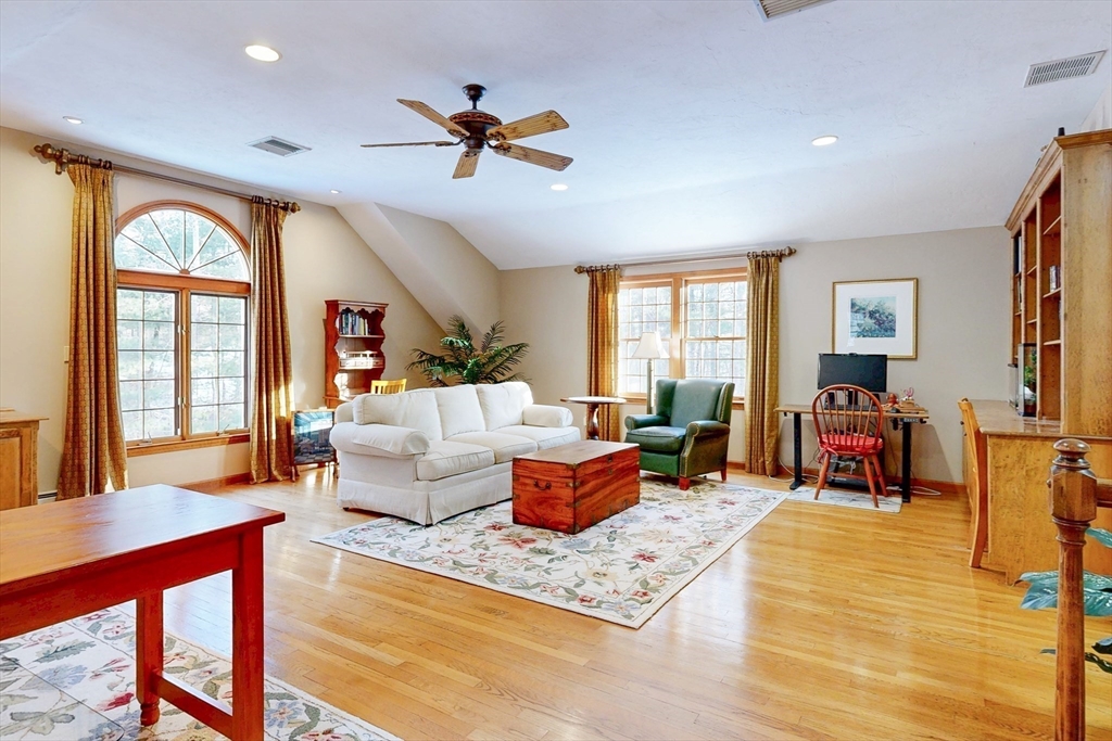 1 Chestnut Lane Medfield, MA 02052 - Photo 16 of 42 a living room with furniture and a large window