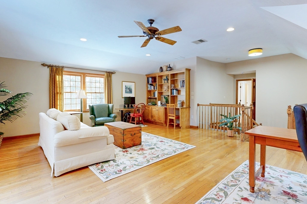 1 Chestnut Lane Medfield, MA 02052 - Photo 17 of 42 a living room with furniture a rug potted plant and a window