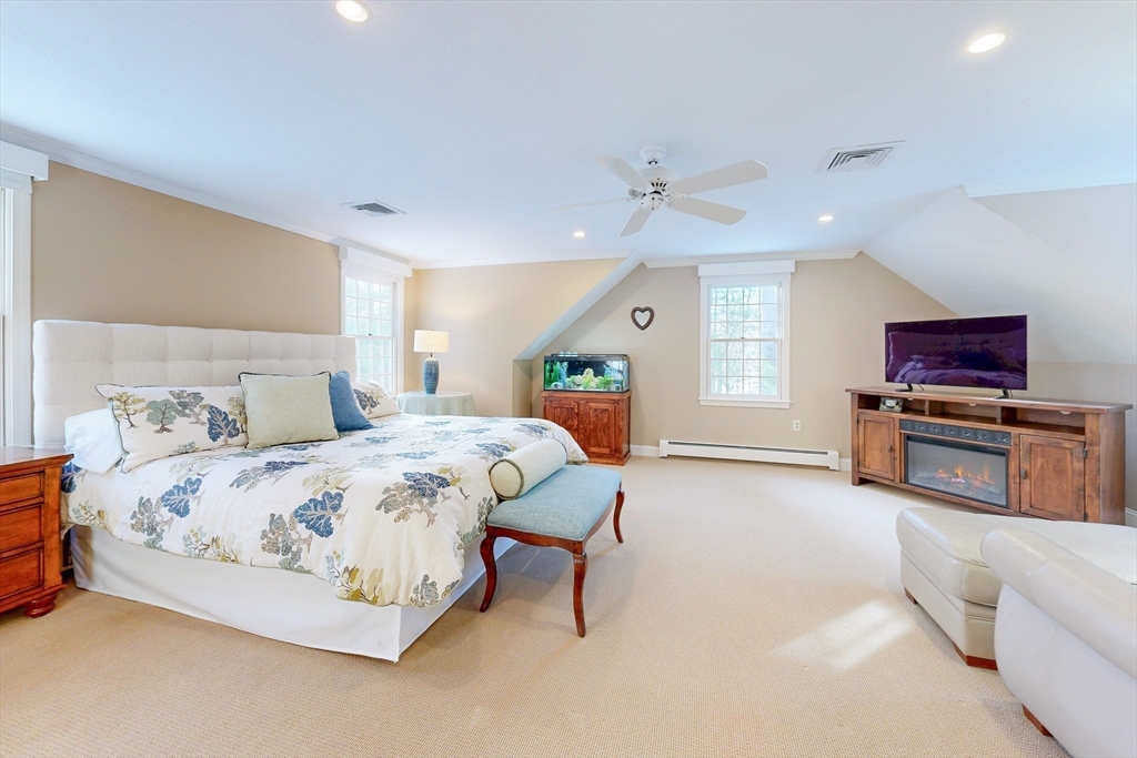 1 Chestnut Lane Medfield, MA 02052 - Photo 19 of 42 a bedroom with a bed and a tv