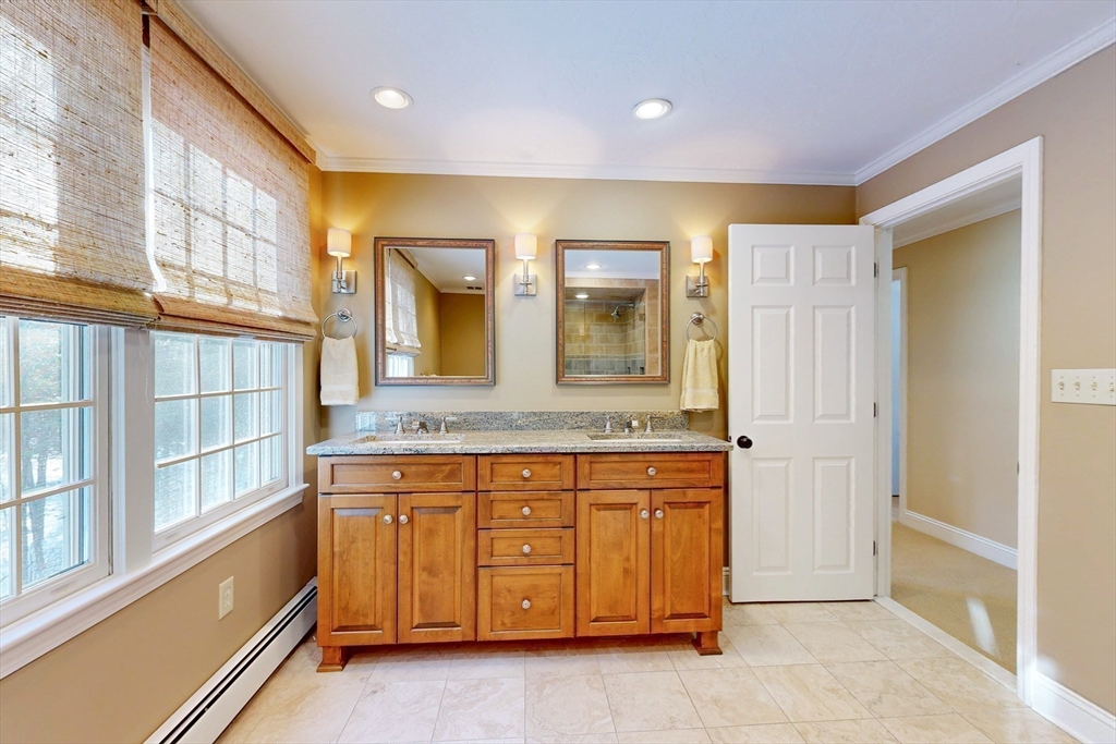 1 Chestnut Lane Medfield, MA 02052 - Photo 26 of 42 a spacious bathroom with a granite countertop sink and a mirror