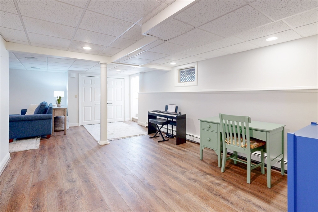 1 Chestnut Lane Medfield, MA 02052 - Photo 36 of 42 a living room with furniture and a wooden floor
