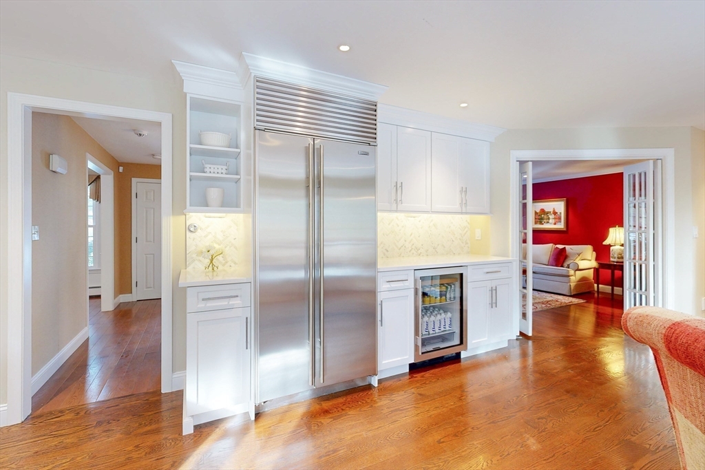1 Chestnut Lane Medfield, MA 02052 - Photo 7 of 42 a view of a kitchen with refrigerator and wooden floor