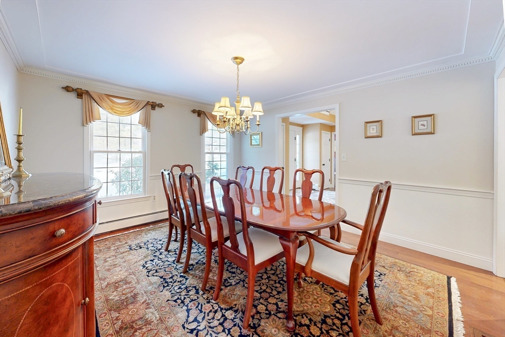 1 Chestnut Lane Medfield, MA 02052 - Photo 10 of 42 a dining room with furniture a chandelier and wooden floor