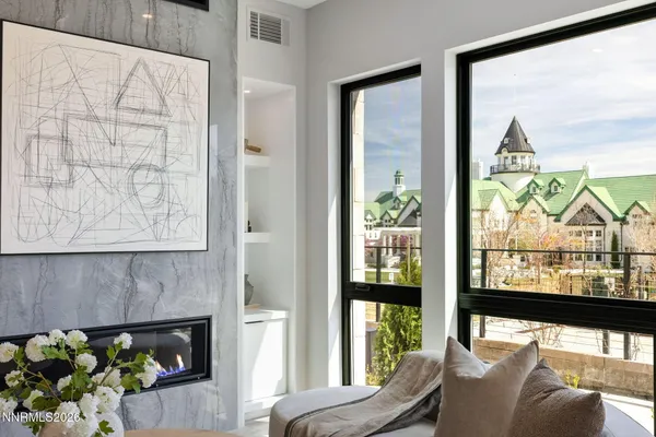 a view of a floor to ceiling window and wooden floor