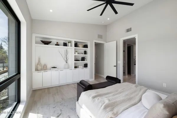 a bathroom with a double vanity sink a mirror and a bathtub